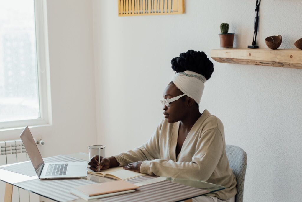 A Woman Journaling from Home
